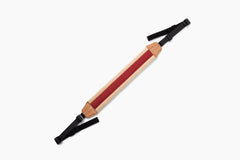 A wooden walking stick with a natural wood shaft, a red center stripe, and black adjustable straps at both ends, shown on a plain white background.